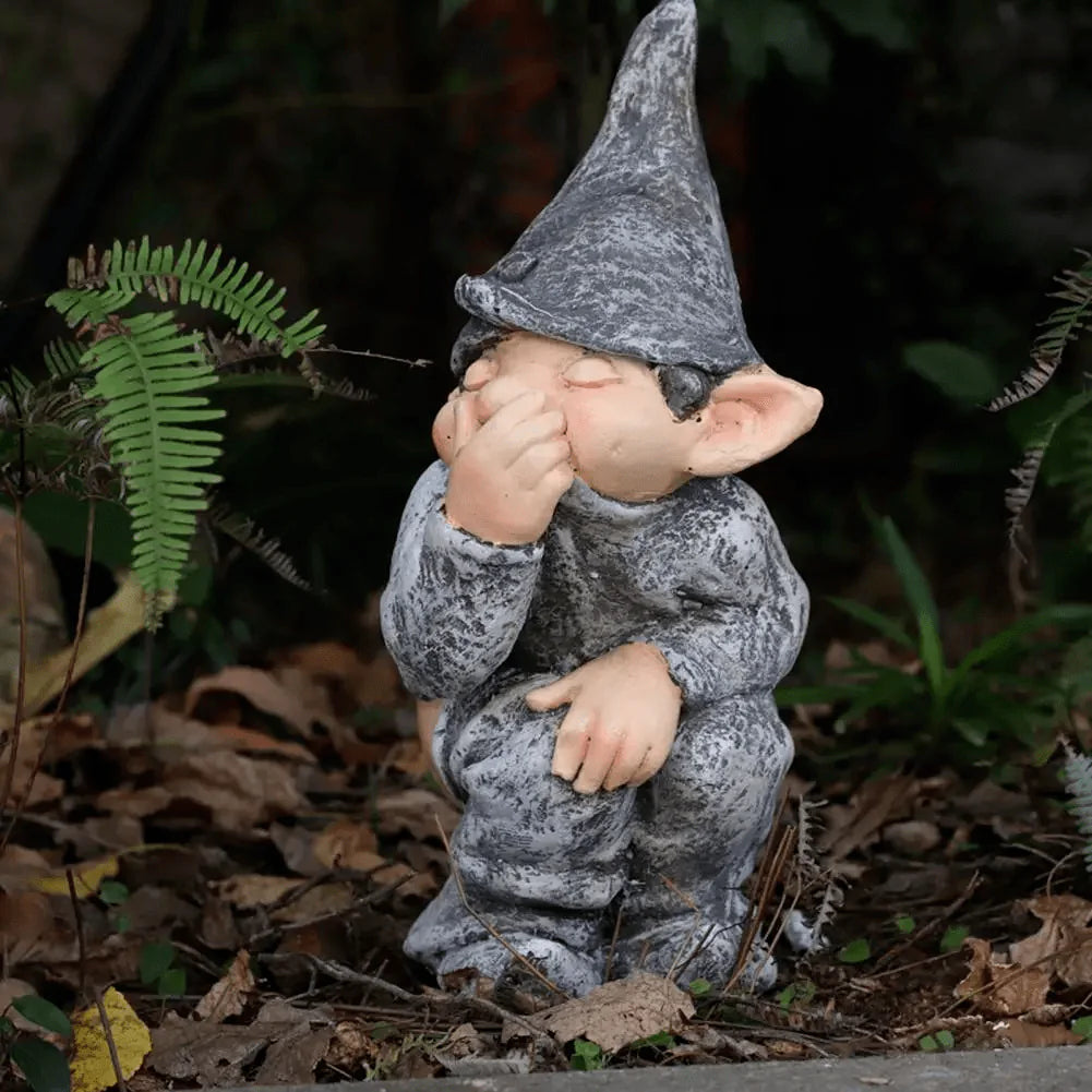 front view of the gnome in a garden