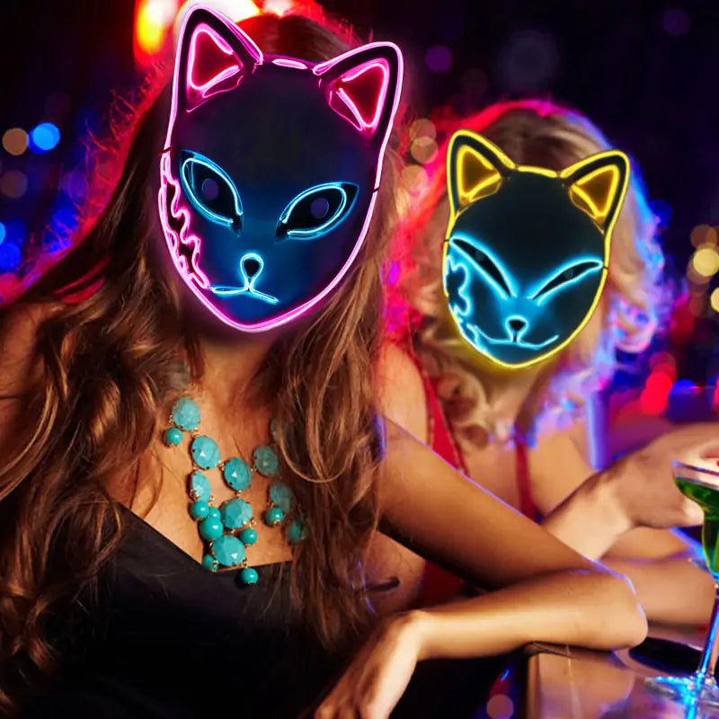 two women wearing the LED cat masks