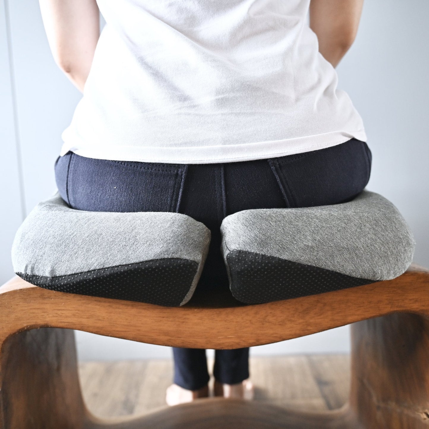 Back view of someone sitting on the cusion